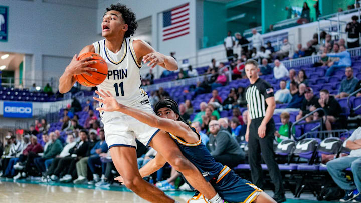 Principia Panthers guard Quentin Coleman (11) is fouled by Wheeler Wildcats guard Kevin Savage III (2) during the fourth quarter of a City of Palms Classic quarterfinal game at Suncoast Credit Union Arena in Fort Myers, Fla., on Saturday, Dec. 20, 2025.