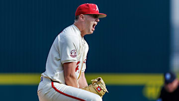 Arkansas Razorback senior pitcher Will McEntire celebrates after a strikeout at Baum Walker Stadium in Fayetteville