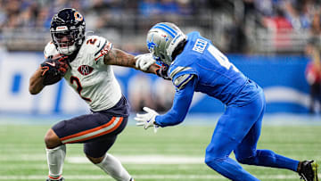 Detroit Lions cornerback D.J. Reed (4) tries to stop Chicago Bears wide receiver DJ Moore (2) during the first half at Ford Field in Detroit on Sunday, Sept. 14, 2025.