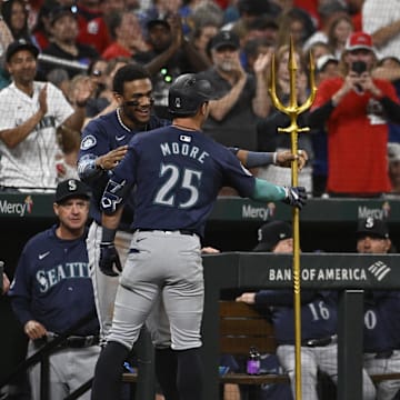 Seattle Mariners second baseman Dylan Moore (25) is congratulated after hitting a two-run home run against the St. Louis Cardinals in the sixth inning at Busch Stadium on Sept 6.