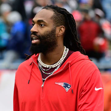 Dec 17, 2023; Foxborough, Massachusetts, USA; New England Patriots linebacker Matthew Judon (9) greets fans before a game against the Kansas City Chiefs at Gillette Stadium. Mandatory Credit: Eric Canha-USA TODAY Sports