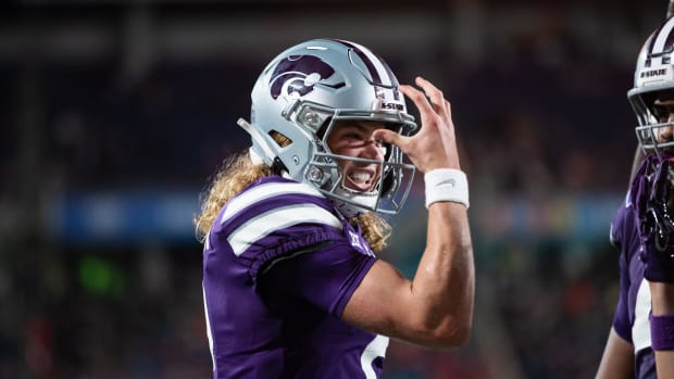 Kansas State quarterback Avery Johnson (2) celebrates his touchdown. Jeremy Reper-USA TODAY Sports