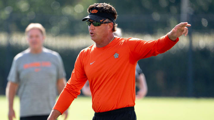 Head coach Mike Gundy walks on the field during an Oklahoma State football practice in Stillwater, Okla., on Saturday, Aug. 3, 2024.