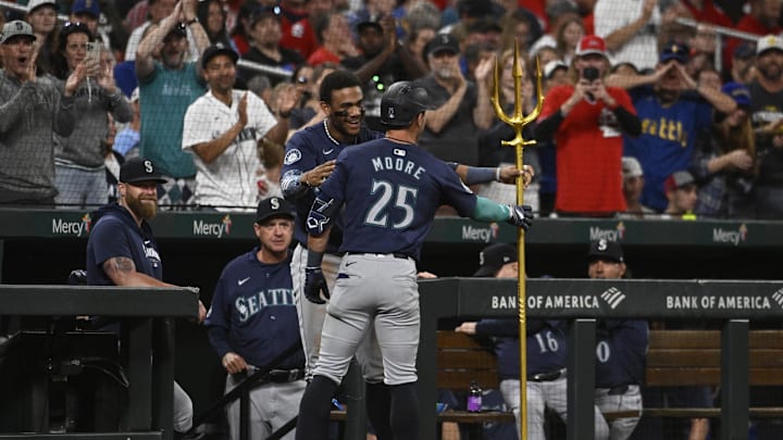 Seattle Mariners second baseman Dylan Moore (25) is congratulated after hitting a two-run home run against the St. Louis Cardinals in the sixth inning at Busch Stadium on Sept 6.