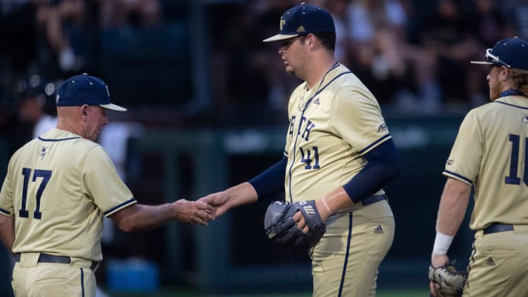 Georgia Tech pitcher Zach Maxwell (41) hands the ball over.