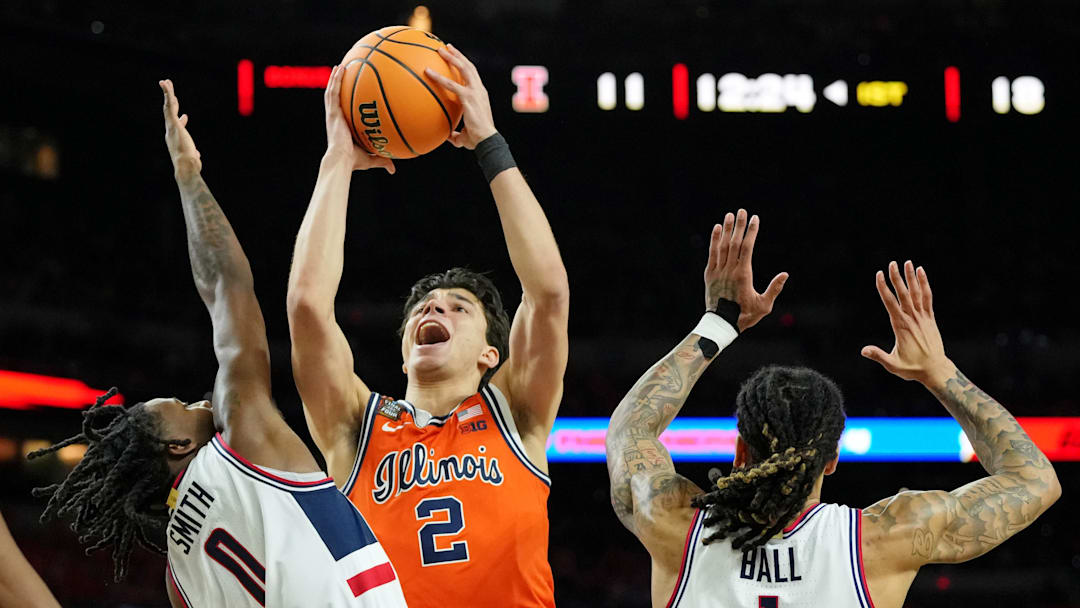 Apr 4, 2026; Indianapolis, IN, USA; Illinois Fighting Illini guard Andrej Stojakovic (2) shoots the ball against UConn Huskies guard Malachi Smith (0) during the first half of a semifinal of the Final Four of the men's 2026 NCAA Tournament at Lucas Oil Stadium. Mandatory Credit: Bob Donnan-Imagn Images