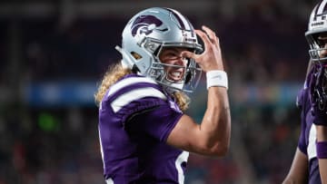 Dec 28, 2023; Orlando, FL, USA; Kansas State quarterback Avery Johnson (2) celebrates his touchdown against NC State in the second quarter at Camping World Stadium. Mandatory Credit: Jeremy Reper-USA TODAY Sports