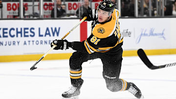 Dec 3, 2024; Boston, Massachusetts, USA; Boston Bruins defenseman Nikita Zadorov (91) shoots and scores against the Detroit Red Wings during the first period at the TD Garden. Mandatory Credit: Brian Fluharty-Imagn Images