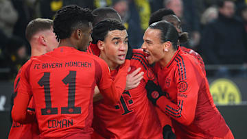 Bayern Munich players celebrating Jamal Musiala's late equaliser against Borussia Dortmund.
