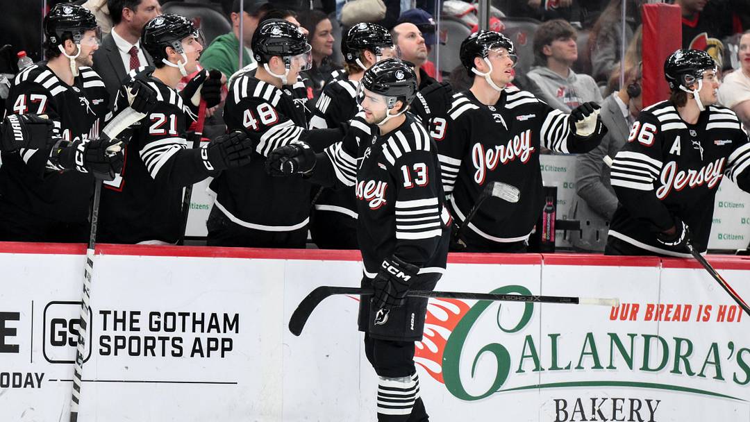 Apr 12, 2026; Newark, New Jersey, USA; New Jersey Devils center Nico Hischier (13) celebrates with teammates after scoring a goal against the Ottawa Senators during the first period at Prudential Center. Mandatory Credit: John Jones-Imagn Images