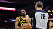 Dec 23, 2023; San Francisco, California, USA; Golden State Warriors forward Jonathan Kuminga (00) reacts after Official  JT Orr (72) calls him for a foul against Portland Trail Blazers forward Jerami Grant (9) during the first half at Chase Center. Mandatory Credit: John Hefti-Imagn Images