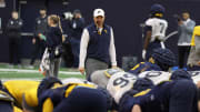 West Virginia head coach Neal Brown looks on during spring practice. 