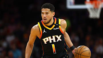 Apr 9, 2025; Phoenix, Arizona, USA; Phoenix Suns guard Devin Booker (1) dribbles the ball against the Oklahoma City Thunder during the first half at Footprint Center. Mandatory Credit: Mark J. Rebilas-Imagn Images