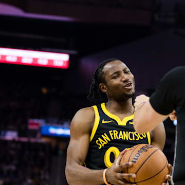 Dec 23, 2023; San Francisco, California, USA; Golden State Warriors forward Jonathan Kuminga (00) reacts after Official  JT Orr (72) calls him for a foul against Portland Trail Blazers forward Jerami Grant (9) during the first half at Chase Center. Mandatory Credit: John Hefti-Imagn Images