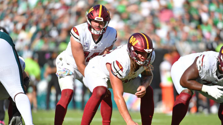 Sam Howell (14) waits for the snap from center Nick Gates (63) against the Philadelphia Eagles at Lincoln Financial Field. 