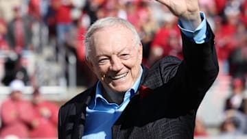 Nov 16, 2024; Fayetteville, Arkansas, USA; Dallas Cowboys owner and member of the 1964 Arkansas Razorbacks National Championship team, Jerry Jones, waves to the crowd as the team is honored during the first half against the Texas Longhorns at Donald W. Reynolds Razorback Stadium. Mandatory Credit: Nelson Chenault-Imagn Images