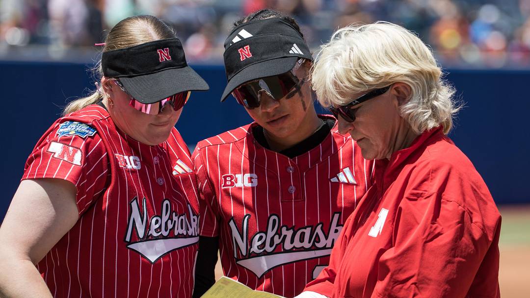 Nebraska Cornhuskers head coach Rhonda Revelle talks with outfielder Kacie Hoffmann (left) and utility Samantha Bland (29) before the game against the Texas Longhorns during the NCAA Women’s College World Series at Devon Park. 