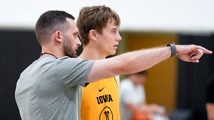 Iowa men’s basketball assistant coach Connor Wheeler talks to Jacob Koch (10) during practice June 19, 2025 at Carver-Hawkeye Arena in Iowa City, Iowa.