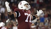 Sep 27, 2025; Stanford, California, USA;  Stanford Cardinal offensive lineman Emeka Ugorji (71) reacts after his teammate scored a touchdown to take the lead during the fourth quarter against the San Jose State Spartans at Stanford Stadium. Mandatory Credit: Stan Szeto-Imagn Images