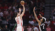 Nov 6, 2024; Houston, Texas, USA; Houston Rockets center Alperen Sengun (28) shoots the ball as San Antonio Spurs center Victor Wembanyama (1) defends during the first quarter at Toyota Center. Mandatory Credit: Troy Taormina-Imagn Images