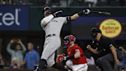 Oct 4, 2022; Arlington, Texas, USA; New York Yankees right fielder Aaron Judge (99) hits his 62nd home run to break the American League home run record in the first inning against the Texas Rangers at Globe Life Field. Mandatory Credit: Tim Heitman-Imagn Images