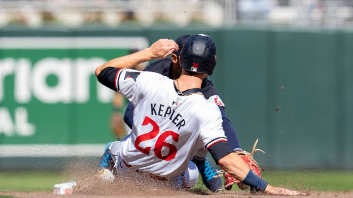 Apr 6, 2024; Minneapolis, Minnesota, USA; Minnesota Twins right fielder Max Kepler (26) is called out at second by Cleveland Guardians second base Andres Gimenez (0) in the sixth inning at Target Field. Mandatory Credit: Matt Blewett-USA TODAY Sports