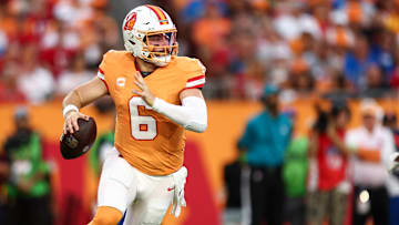 Tampa Bay Buccaneers QB Baker Mayfield wearing the team's throwback creamsicle uniform. 