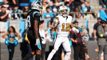 New Orleans Saints WR Chris Olave (12) laughs at Carolina Panthers CB Jaycee Horn (8) after scoring a touchdown on him on Nov. 10, 2025. 