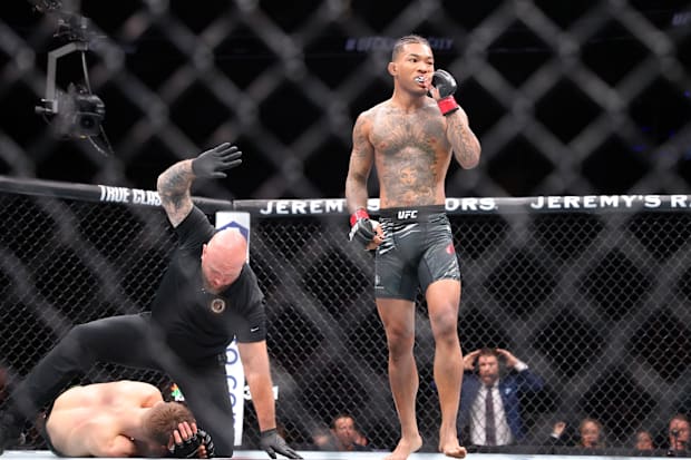 Malcolm Wellmaker (red gloves) reacts after defeating  Cameron Saaiman (blue gloves) during UFC Fight Night at T-Mobile Cente