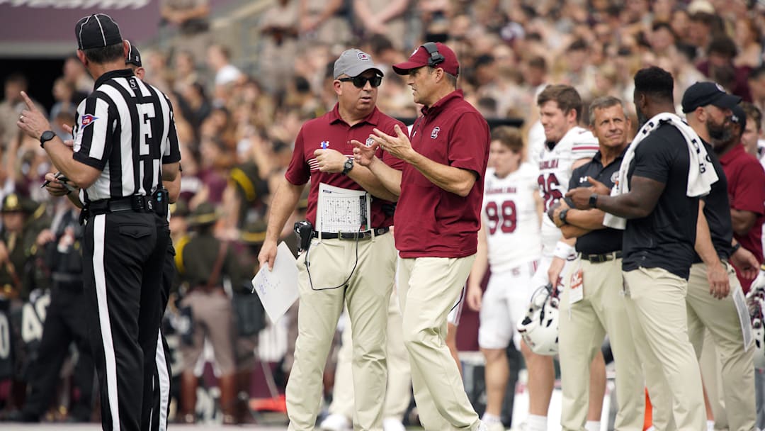 Oct 28, 2023; College Station, Texas, USA; South Carolina Gamecocks head coach Shane Beamer and assistant coach Pete Lembo work the sideline during the second quarter in a game against Texas A&M Aggies at Kyle Field. Mandatory Credit: Dustin Safranek-Imagn Images
