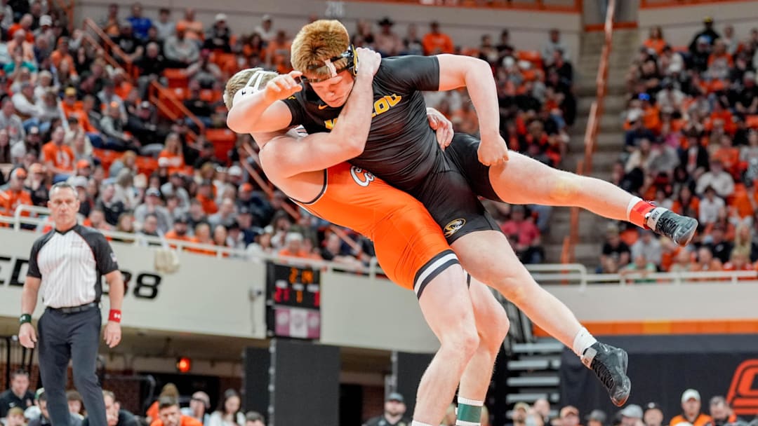 Oklahoma State’s Dustin Plott takes down Missouri’s Aeoden Sinclair during an NCAA wrestling meet between Oklahoma State and Missouri at Gallagher-Iba Arena in Stillwater, Okla., on Sunday, Feb. 2, 2025.