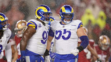 Dec 12, 2024; Santa Clara, California, USA; Los Angeles Rams defensive tackle Kobie Turner (91) is congratulated by defensive tackle Braden Fiske (55) after recording a sack against the San Francisco 49ers in the second quarter at Levi's Stadium. Mandatory Credit: Cary Edmondson-Imagn Images