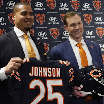 Chicago Bears new head coach Ben Johnson (right) with general manager Ryan Poles pose for photos after a press conference introducing