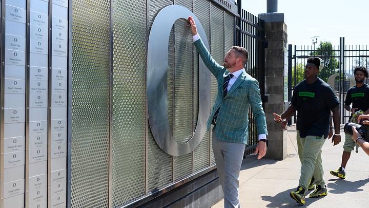 Aug 31, 2024; Eugene, Oregon, USA; Oregon Ducks head coach Dan Lanning touches the O logo before the game against the Idaho Vandals at Autzen Stadium. Mandatory Credit: Craig Strobeck-Imagn Images