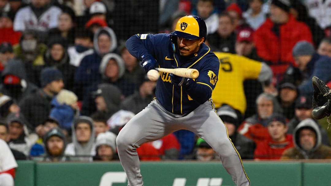 Apr 7, 2026; Boston, Massachusetts, USA; Milwaukee Brewers second baseman David Hamilton (6) bunts against the Boston Red Sox during the third inning at Fenway Park. Mandatory Credit: Eric Canha-Imagn Images