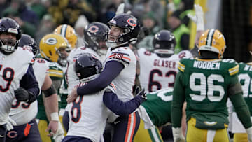 Cairo Santos is mobbed by Bears teammates after his field goal beat the Packers 24-22 in the 2024 season finale. 