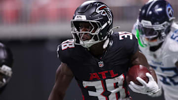 Aug 15, 2025; Atlanta, Georgia, USA; Atlanta Falcons running back Nathan Carter (38) runs the ball against the Tennessee Titans in the first quarter at Mercedes-Benz Stadium. Mandatory Credit: Brett Davis-Imagn Images