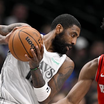 Feb 8, 2025; Dallas, Texas, USA; Dallas Mavericks guard Kyrie Irving (11) and Houston Rockets forward Amen Thompson (1) in action during the game between the Dallas Mavericks and the Houston Rockets at the American Airlines Center. Mandatory Credit: Jerome Miron-Imagn Images