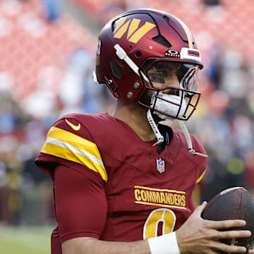 Nov 9, 2025; Landover, Maryland, USA;  Washington Commanders quarterback Marcus Mariota (8) warms up before a game against the Detroit Lions at Northwest Stadium. Mandatory Credit: Geoff Burke-Imagn Images