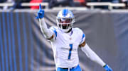 Former Detroit Lions cornerback Jeff Okudah celebrates his interception for a touchdown in 2022.