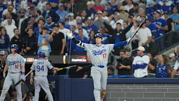Nov 1, 2025; Toronto, Ontario, CAN; Los Angeles Dodgers two-way player Shohei Ohtani (17) reacts as second baseman Miguel Rojas (not pictured) hits a home run against the Toronto Blue Jays in the ninth inning for game seven of the 2025 MLB World Series at Rogers Centre. Mandatory Credit: Nick Turchiaro-Imagn Images