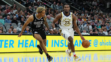 Mar 3, 2024; San Antonio, Texas, USA;  Indiana Pacers forward Aaron Nesmith (23) dribbles against San Antonio Spurs forward Jeremy Sochan (10) in the first half at Frost Bank Center. Mandatory Credit: Daniel Dunn-Imagn Images
