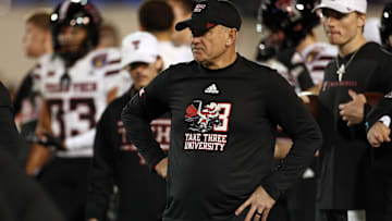 Dec 27, 2024; Memphis, TN, USA; Texas Tech Red Raiders head coach Joey McGuire looks on during warm ups prior to the game against the Arkansas Razorbacks at Simmons Bank Liberty Stadium. Mandatory Credit: Petre Thomas-Imagn Images