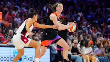 Team WNBA guard Caitlin Clark drives against Team USA guard Kelsey Plum during the WNBA All-Star Game at Footprint Center in Phoenix on July 20, 2024.