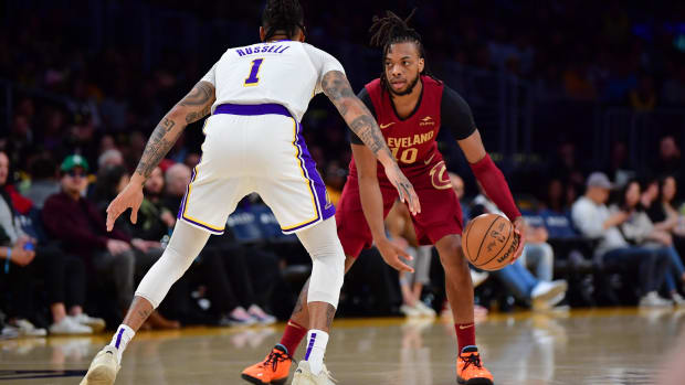 Darius Garland moves the ball against guard D’Angelo Russell.