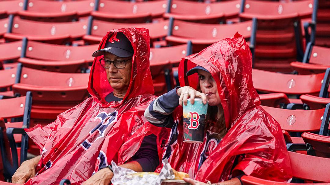 Aug 10, 2023; Boston, Massachusetts, USA; Boston Red Sox fans prepared for rain before the game against the Kansas City Royals at Fenway Park. Mandatory Credit: David Butler II-Imagn Images
