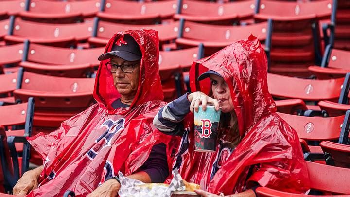 Aug 10, 2023; Boston, Massachusetts, USA; Boston Red Sox fans prepared for rain before the game against the Kansas City Royals at Fenway Park. Mandatory Credit: David Butler II-Imagn Images