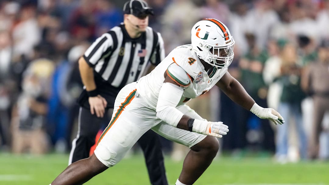 Jan 8, 2026; Glendale, AZ, USA; Miami Hurricanes defensive lineman Rueben Bain Jr. (4) against the Mississippi Rebels during the 2026 Fiesta Bowl and semifinal game of the College Football Playoff at State Farm Stadium. Mandatory Credit: Mark J. Rebilas-Imagn Images