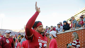 OU quarterback Caleb Williams (13) waves to the crowd after a win against Texas Tech on Oct. 30 in