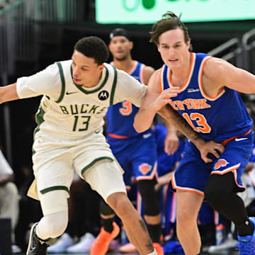 Oct 28, 2025; Milwaukee, Wisconsin, USA;  Milwaukee Bucks guard Ryan Rollins (13) steals the ball from New York Knicks guard Tyler Kolek (13) in the second quarter at Fiserv Forum. Mandatory Credit: Benny Sieu-Imagn Images